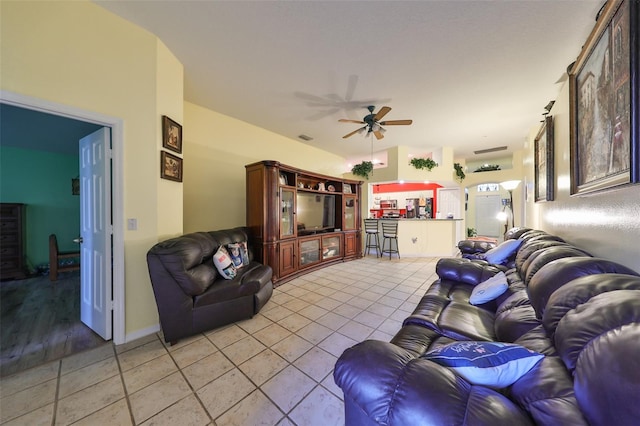 living room featuring ceiling fan and light hardwood / wood-style flooring