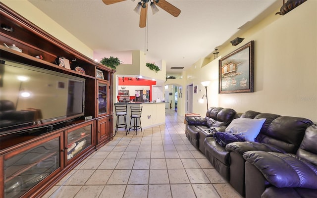 living room with ceiling fan and light tile patterned floors