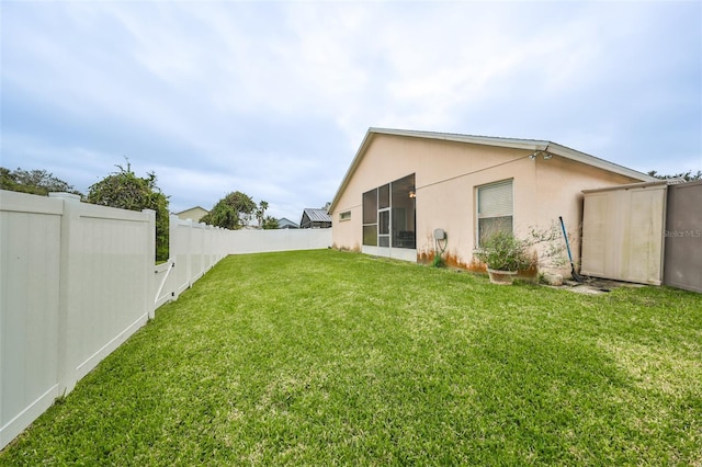 rear view of house with a lawn