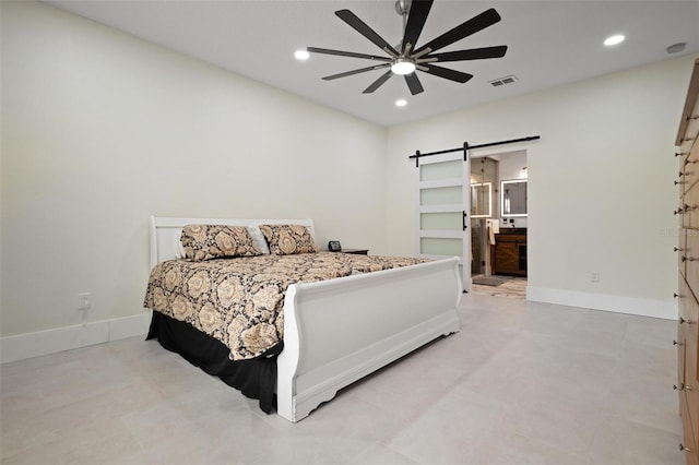 bedroom featuring a barn door, recessed lighting, visible vents, and baseboards