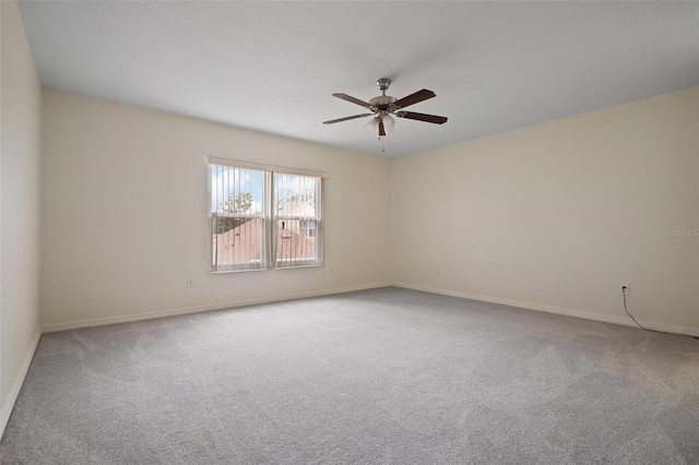 spare room with ceiling fan and carpet floors