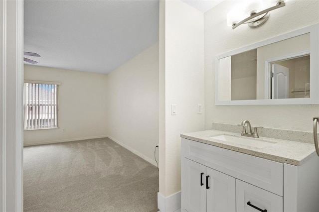 bathroom featuring vanity and baseboards