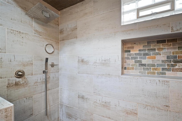 full bath featuring tiled shower