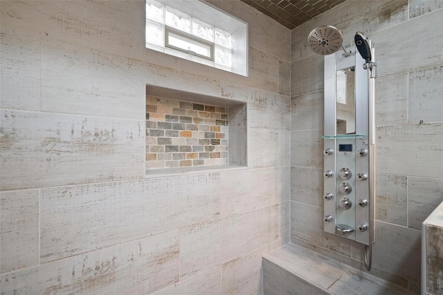 bathroom featuring a tile shower