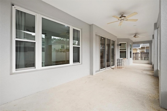 view of patio featuring ceiling fan