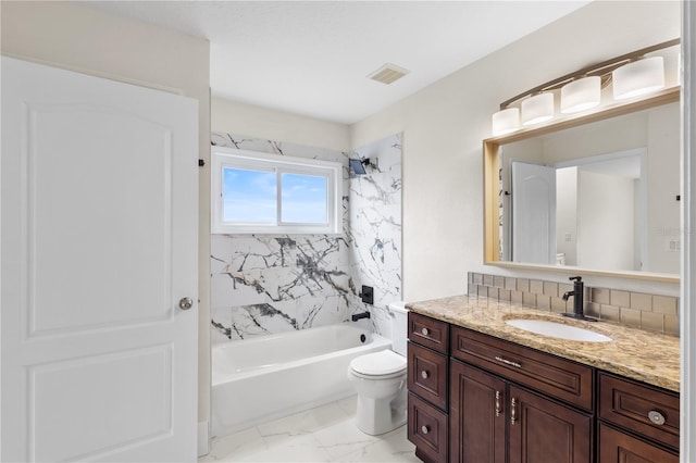 bathroom with visible vents, toilet, bathing tub / shower combination, marble finish floor, and vanity