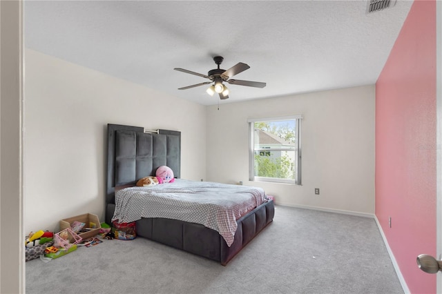 bedroom featuring visible vents, baseboards, carpet, and ceiling fan