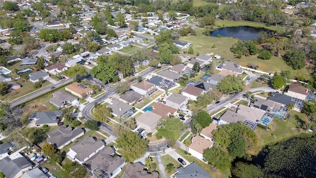 bird's eye view featuring a water view and a residential view