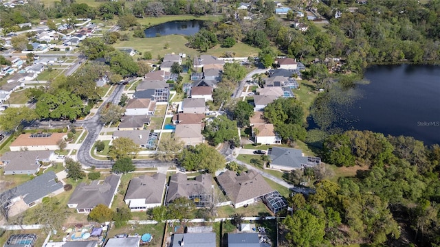 bird's eye view featuring a residential view and a water view