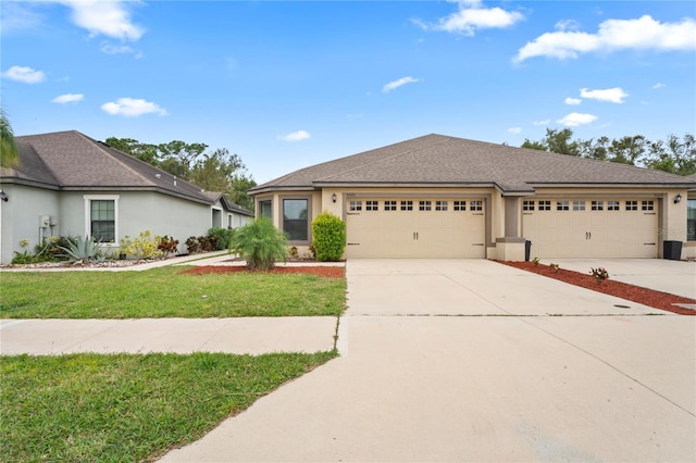 view of front facade featuring a front yard and a garage