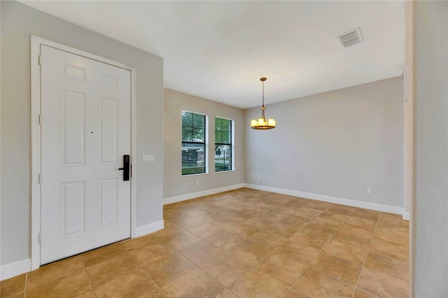 interior space featuring an inviting chandelier