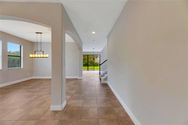 corridor with light tile patterned floors