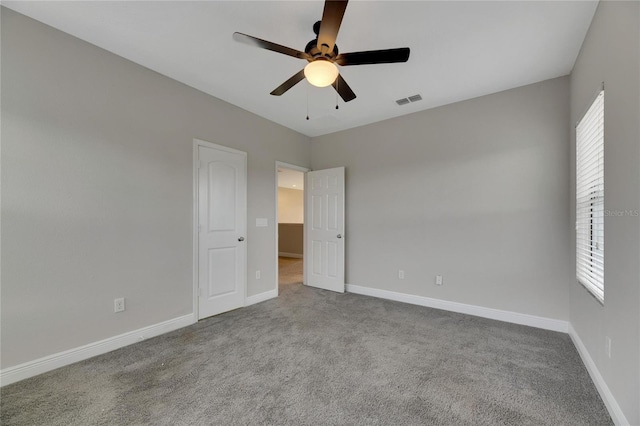 unfurnished bedroom with light colored carpet and ceiling fan