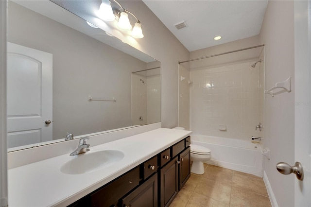 full bathroom with tile patterned flooring, vanity, toilet, and tiled shower / bath