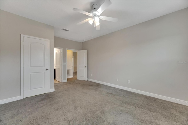 unfurnished bedroom featuring ceiling fan and light carpet