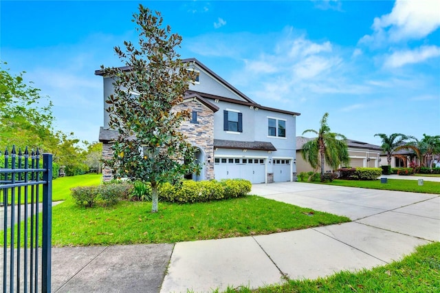 view of front facade with a front yard and a garage