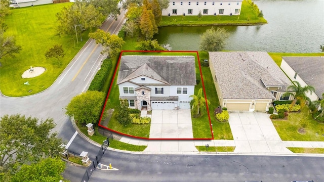 bird's eye view with a water view