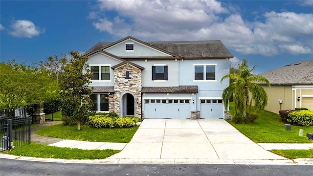 front facade featuring a garage and a front yard