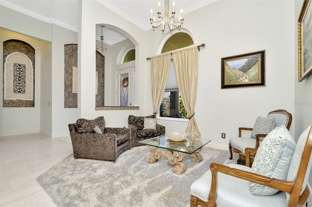 sitting room with crown molding and an inviting chandelier