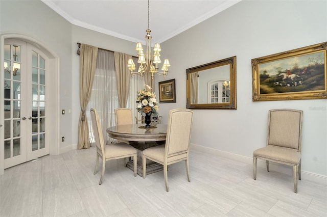 dining area with a chandelier, french doors, and ornamental molding