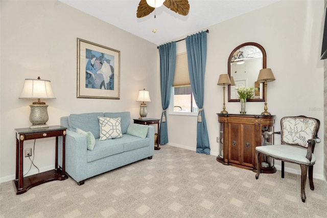 sitting room featuring ceiling fan and light carpet