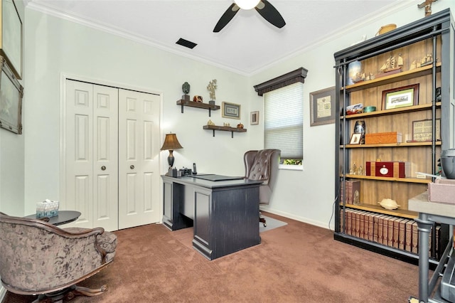 office space with crown molding, ceiling fan, and dark colored carpet