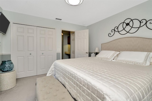 carpeted bedroom featuring a closet