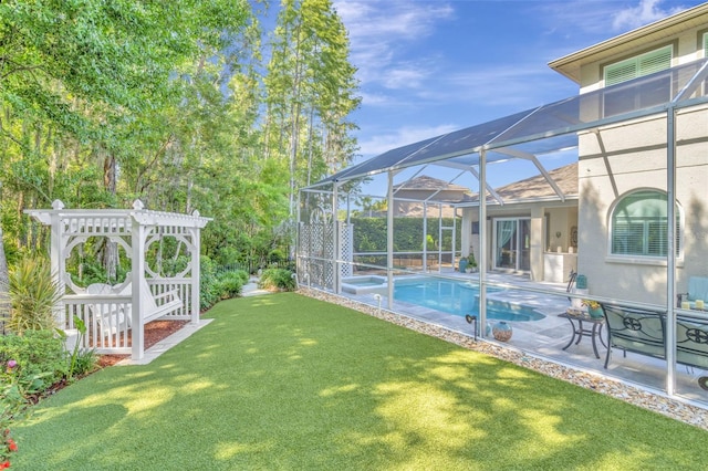 exterior space with a patio area, a lanai, and a fenced in pool