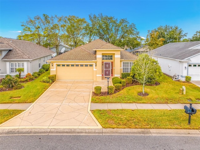 view of front of property with a garage and a front lawn