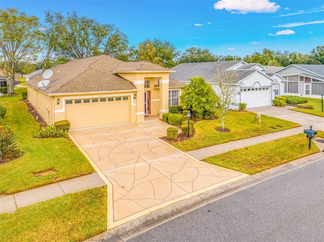 view of front of property featuring a garage and a front yard