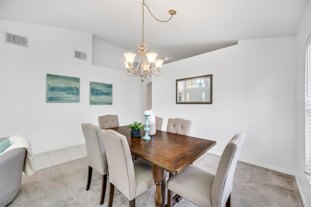 carpeted dining room with a notable chandelier