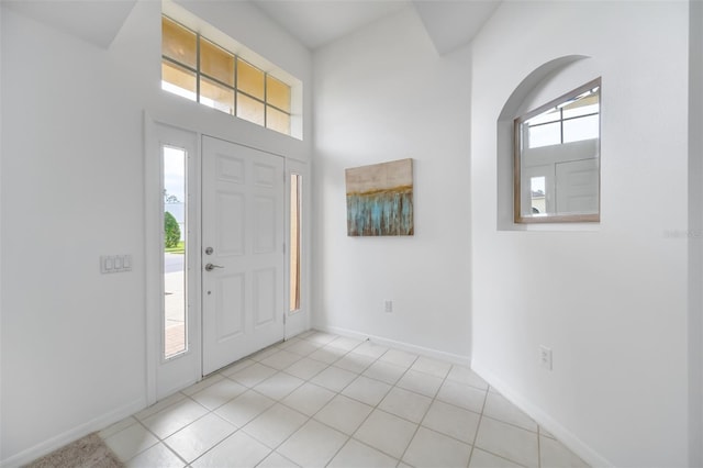 foyer entrance with light tile patterned flooring