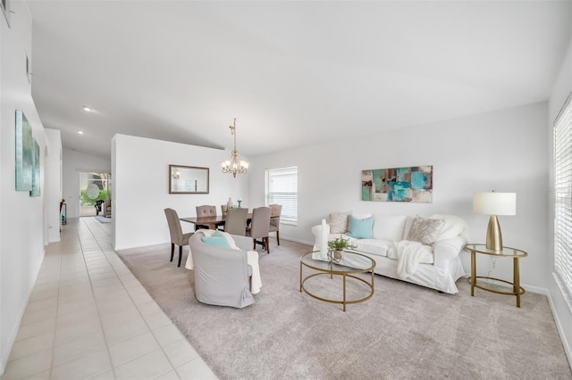 tiled living room featuring lofted ceiling and a chandelier