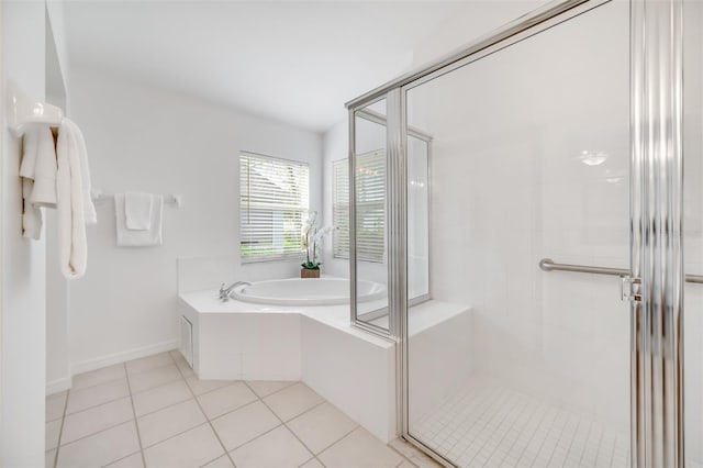 bathroom featuring tile patterned flooring and independent shower and bath