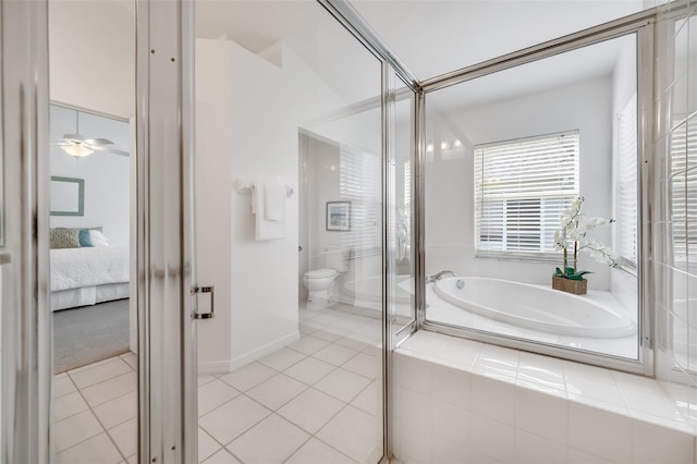 bathroom featuring toilet, independent shower and bath, and tile patterned flooring