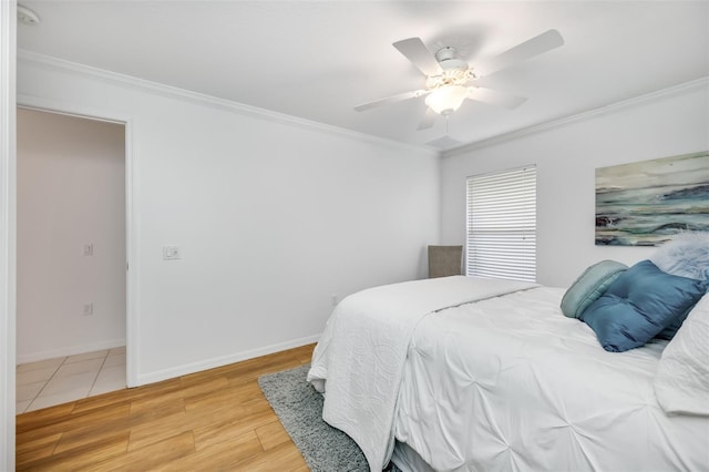 bedroom featuring crown molding, ceiling fan, and hardwood / wood-style floors