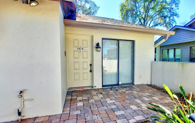 entrance to property with a patio area