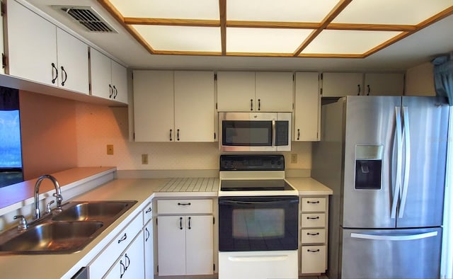 kitchen featuring sink, white cabinetry, and stainless steel appliances