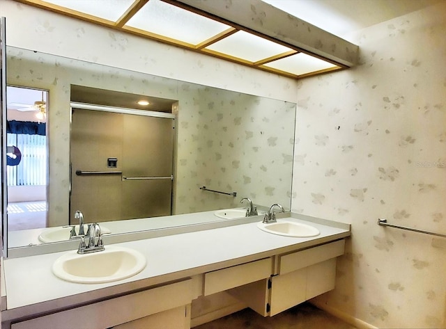 bathroom featuring ceiling fan and vanity