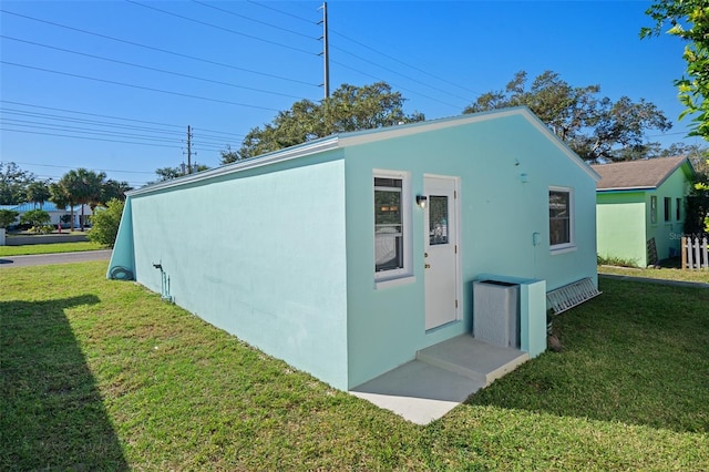 view of outdoor structure with a lawn