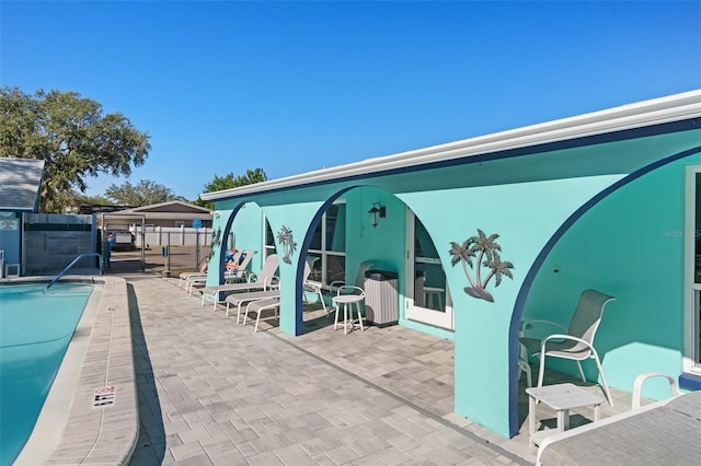 view of pool featuring a patio