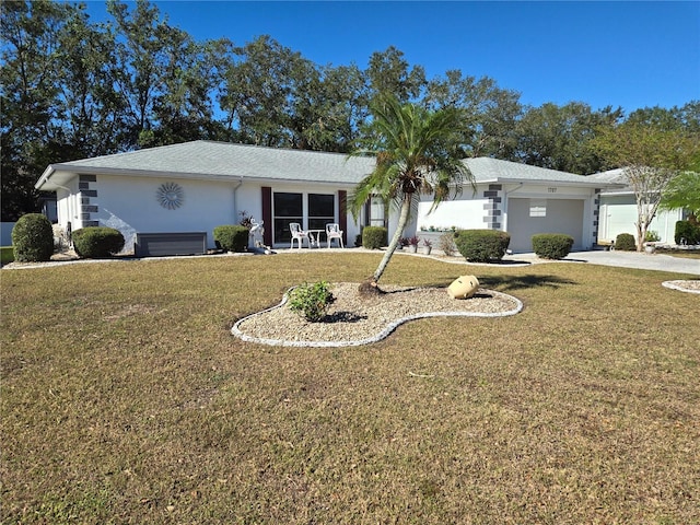 ranch-style house with a front yard and a garage