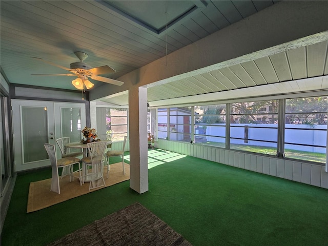 sunroom / solarium featuring ceiling fan