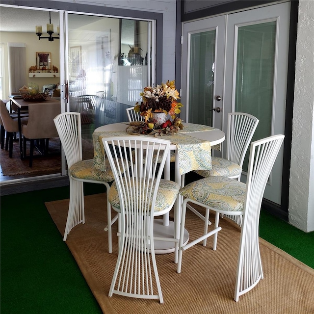 dining room featuring carpet flooring and plenty of natural light