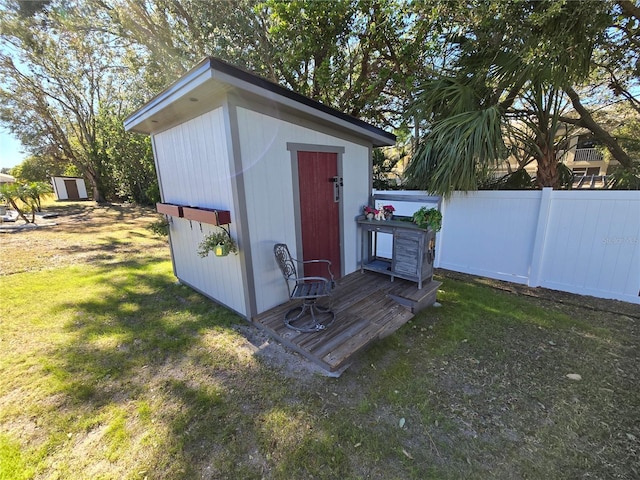 view of outbuilding with a yard