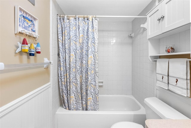 bathroom featuring toilet and shower / bathtub combination with curtain