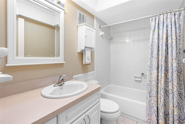 full bathroom with shower / bath combination with curtain, vanity, toilet, and tile patterned floors