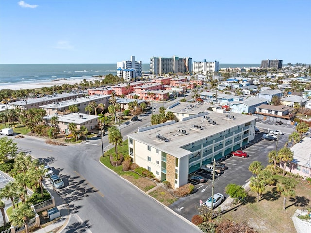 drone / aerial view with a water view and a view of the beach