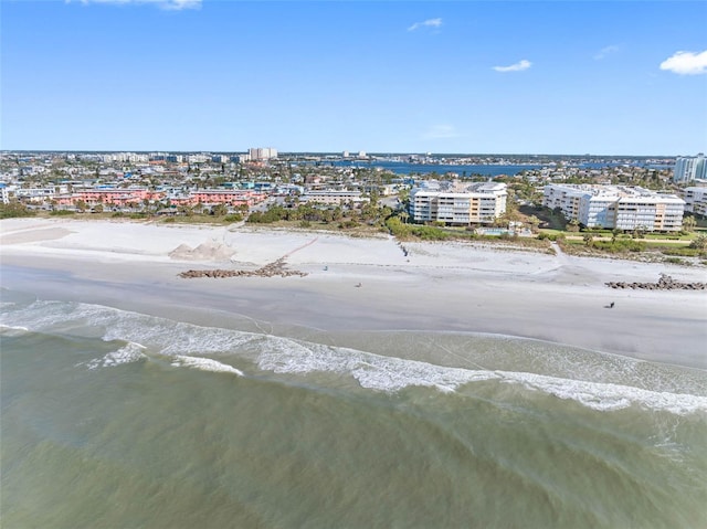 birds eye view of property featuring a water view and a view of the beach