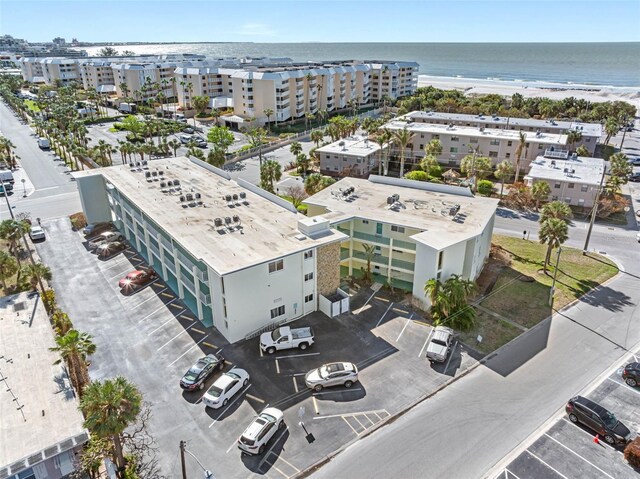 drone / aerial view with a water view and a view of the beach